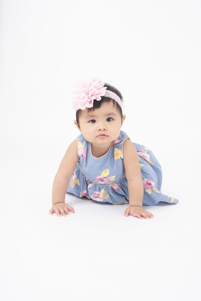 Adorable Asian baby girl is portrait on white background photo