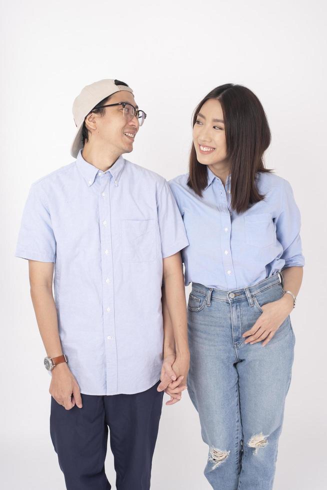 Happy Asian couple in love on white background photo