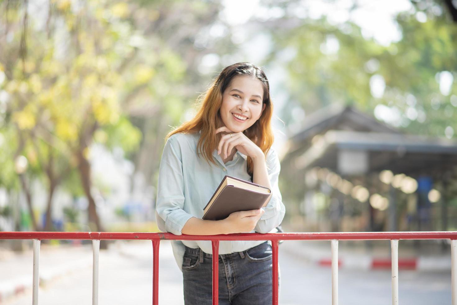 Happy young Asian University student. photo