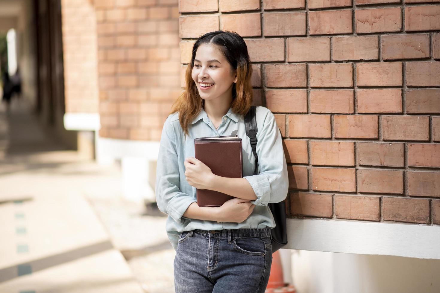 Happy young Asian University student. photo