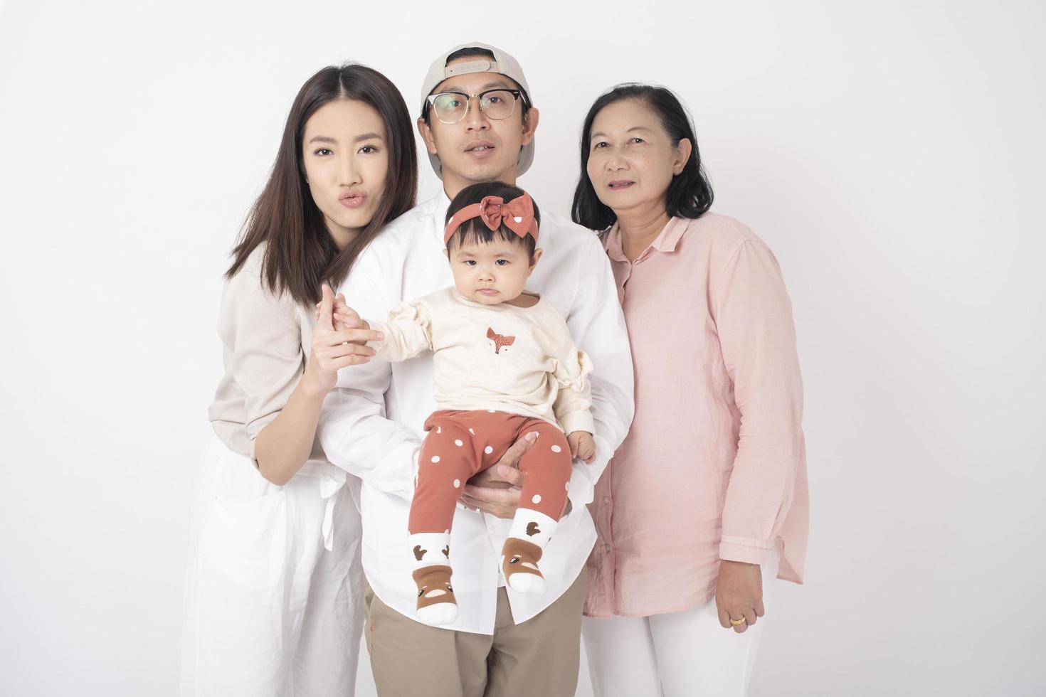 Happy Asian family on white background photo