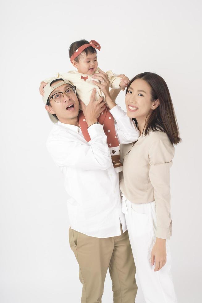 Happy Asian family on white background photo