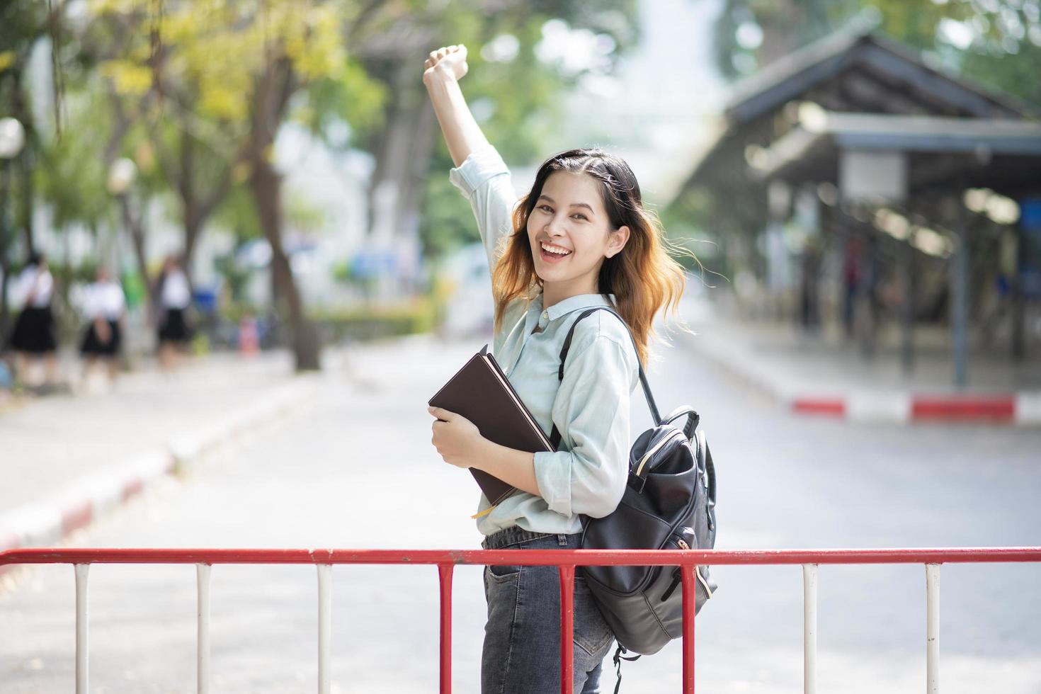 Happy young Asian University student. photo