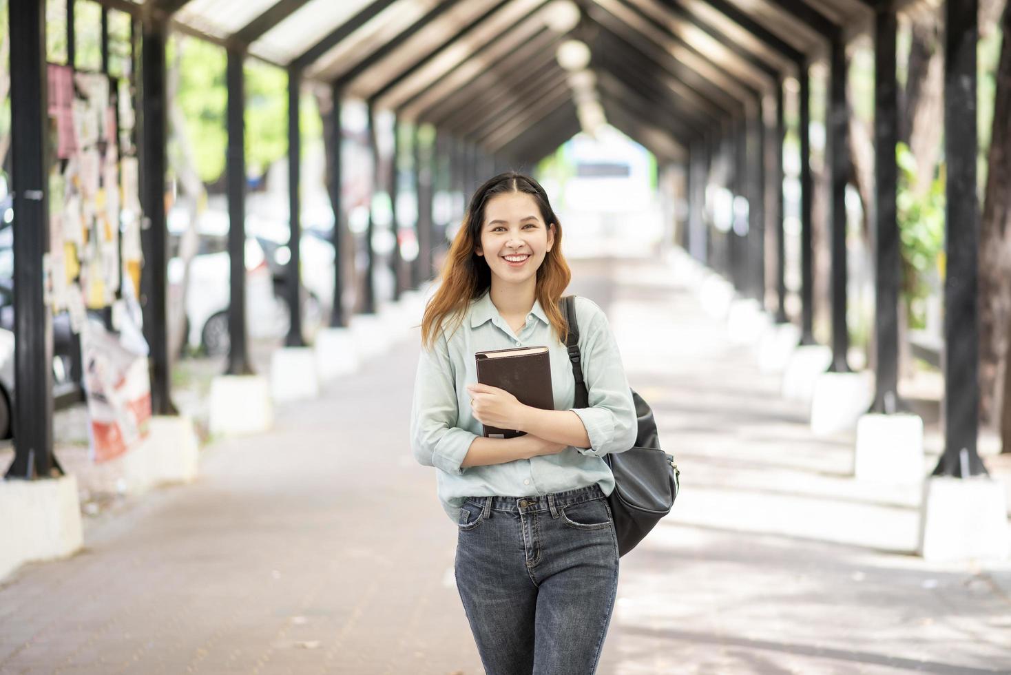 Happy young Asian University student. photo