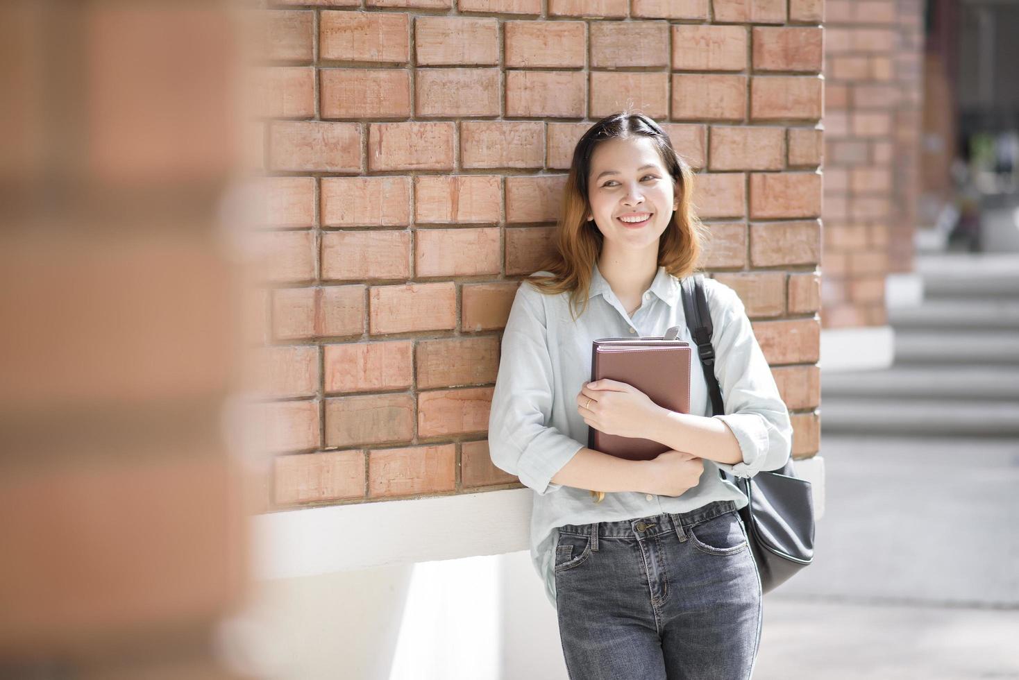 Happy young Asian University student. photo