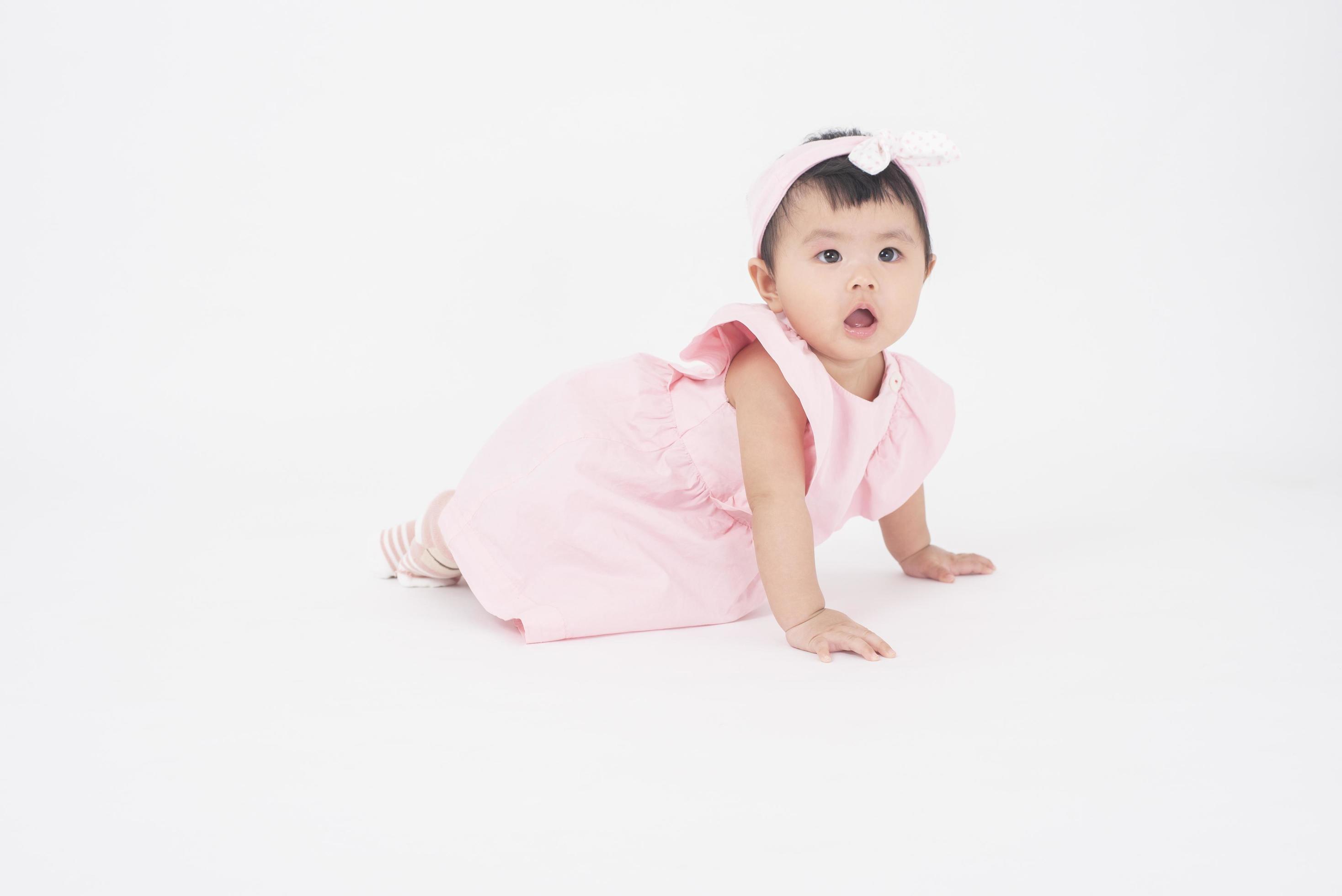 Adorable Asian baby girl is portrait on white background 5085929 Stock Photo  at Vecteezy