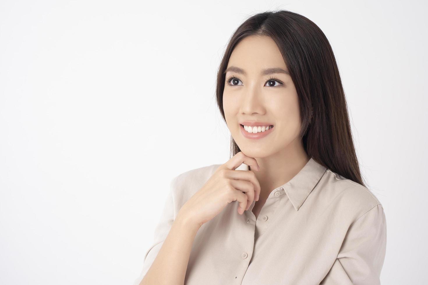 Close up of Asian woman with beautiful teeth on white background photo