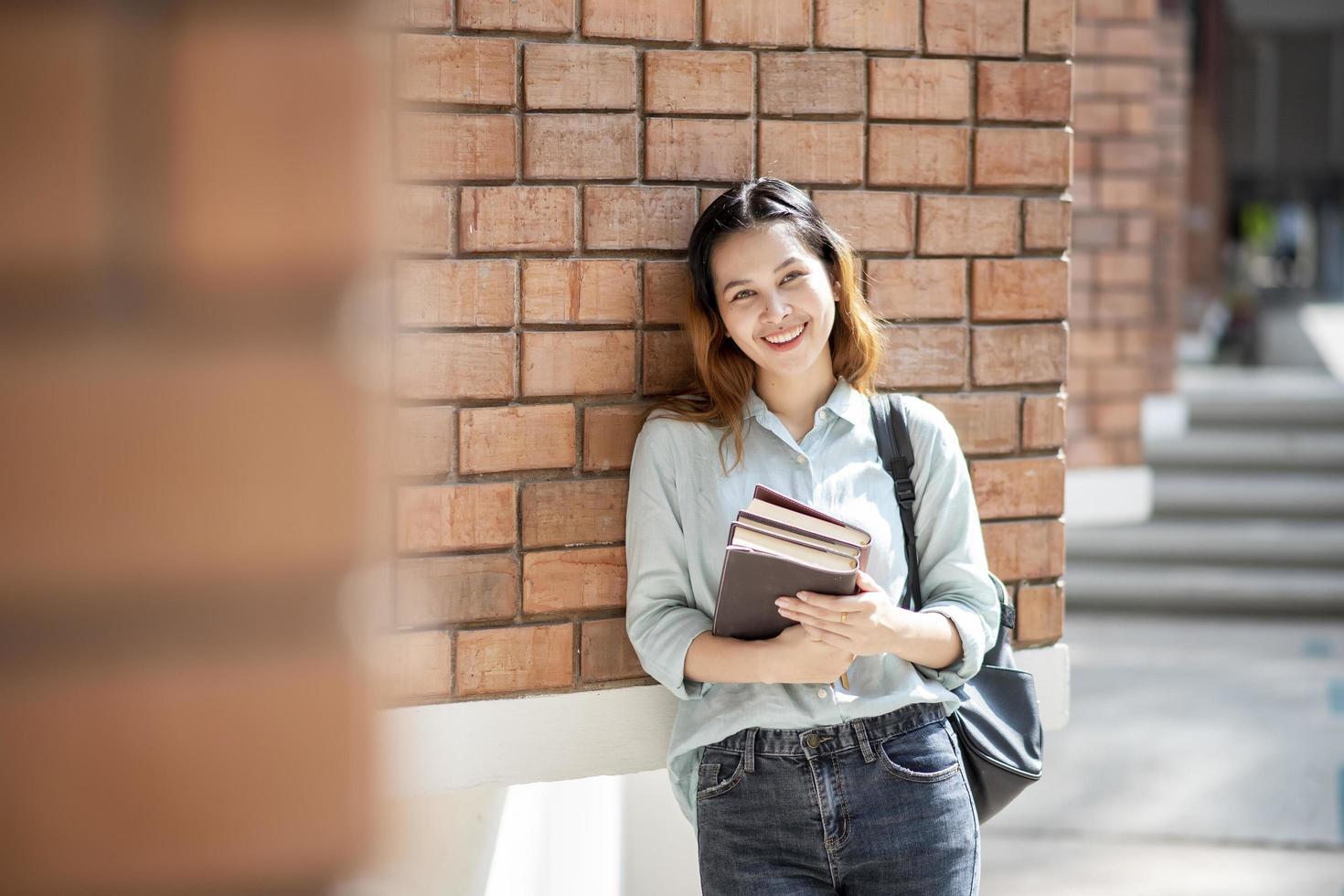 Happy young Asian University student. photo