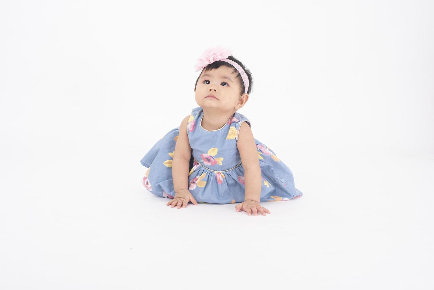 Adorable Asian baby girl is portrait on white background photo