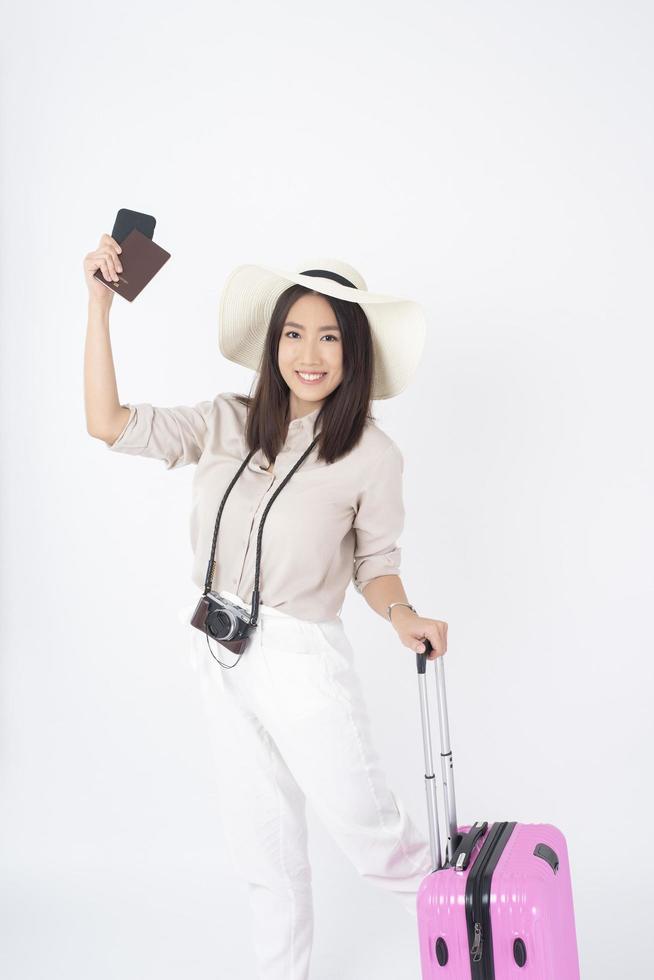 Beautiful Asian woman tourist  on white background photo