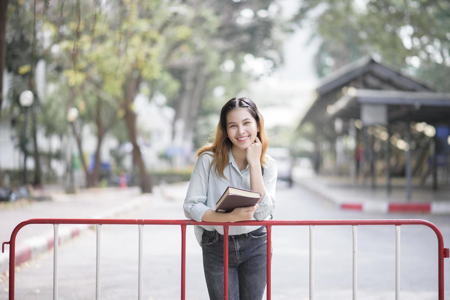 Happy young Asian University student. photo