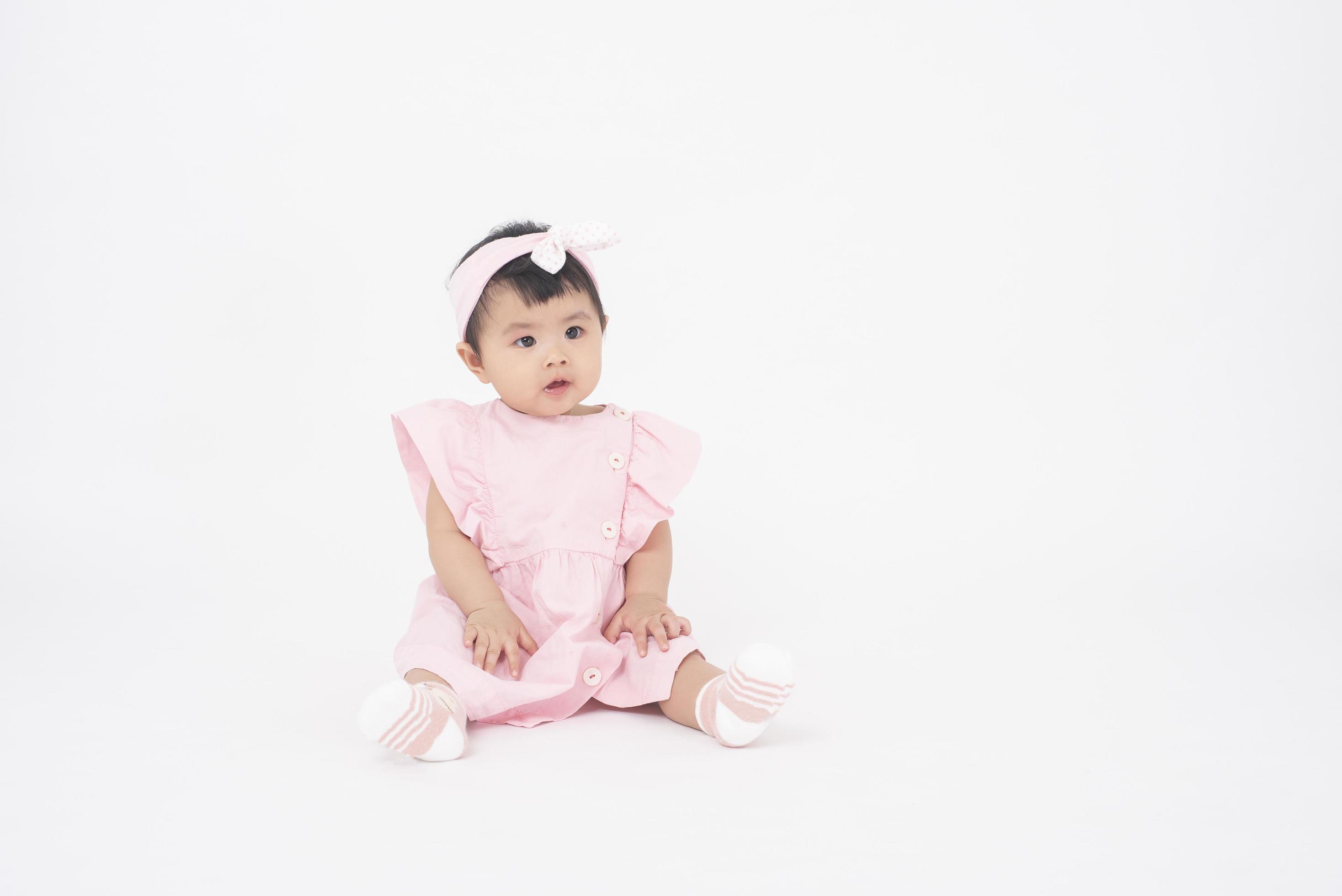 Adorable Asian baby girl is portrait on white background 5086678 Stock Photo  at Vecteezy