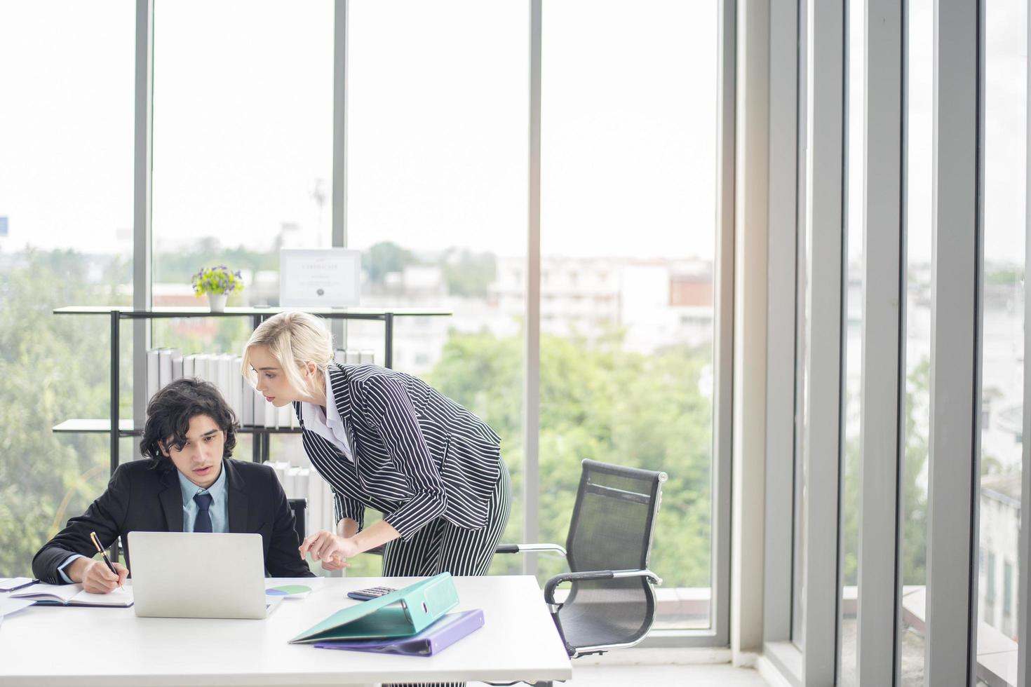 Business man and business woman are analytics business data, business plan concept photo