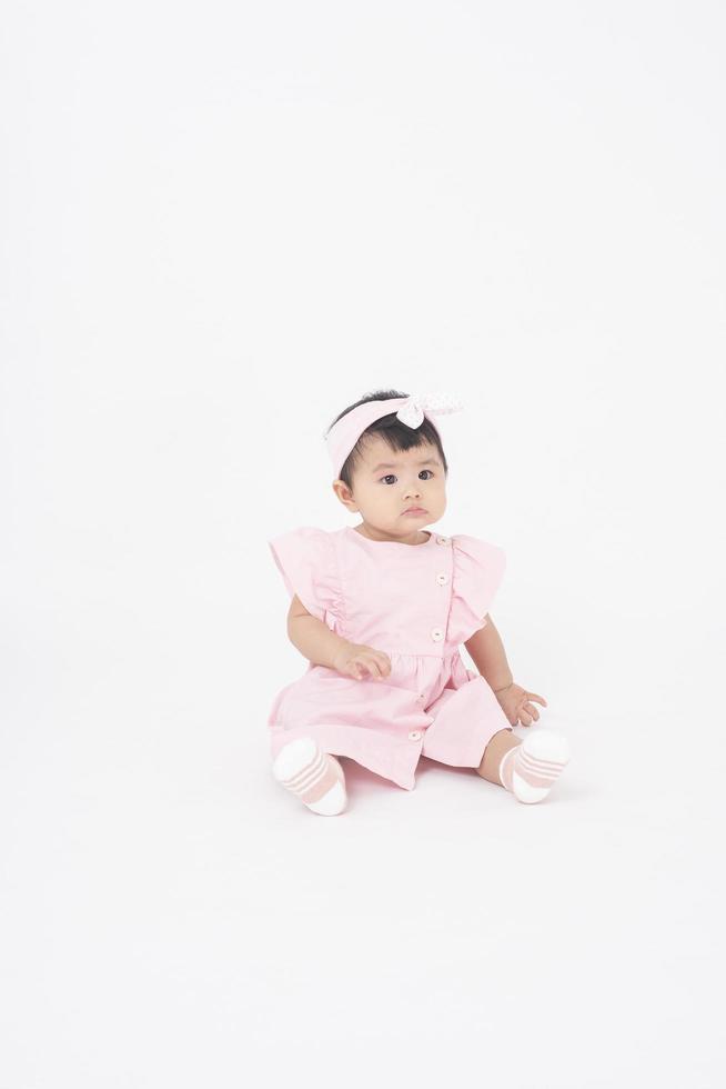 Adorable Asian baby girl is portrait on white background photo