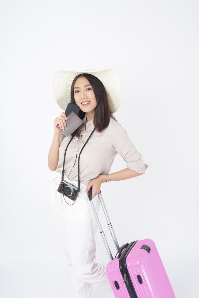 Beautiful Asian woman tourist  on white background photo