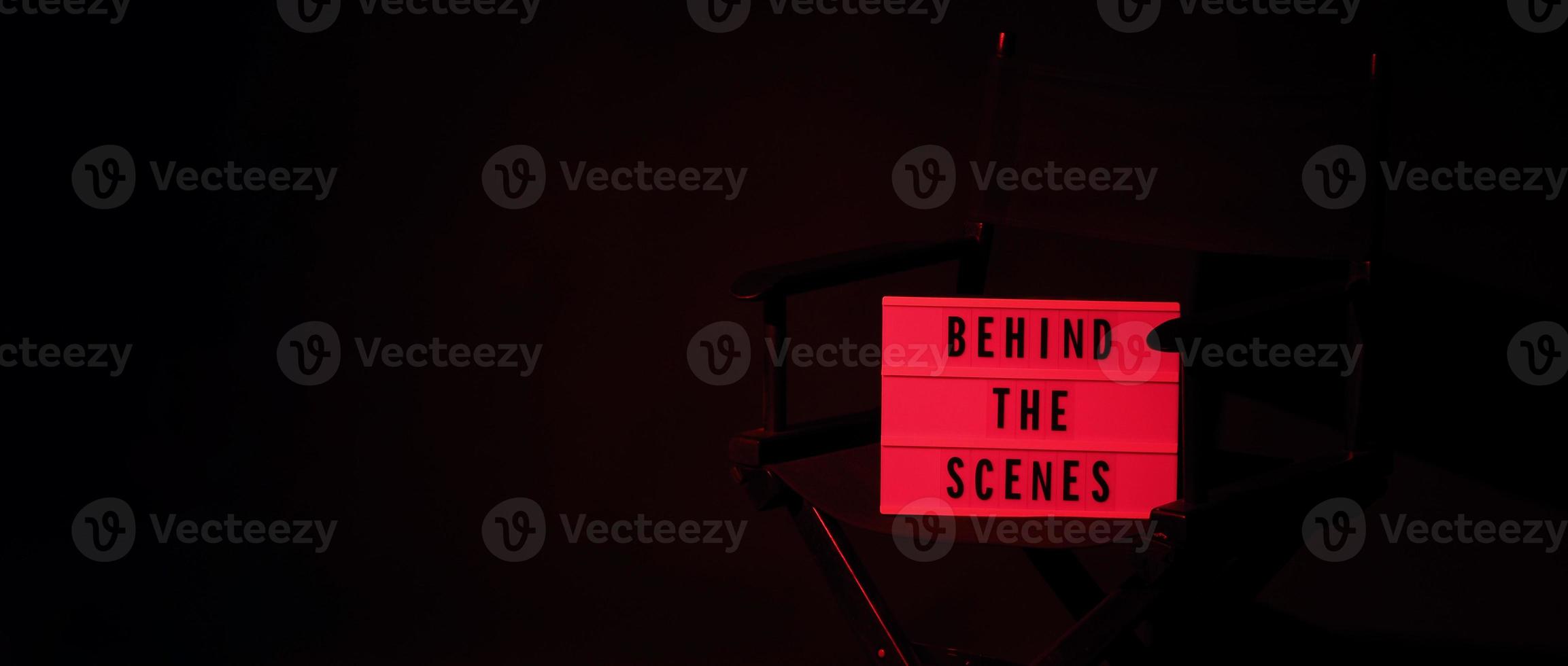 Director chair with behind the scene banner light box. photo