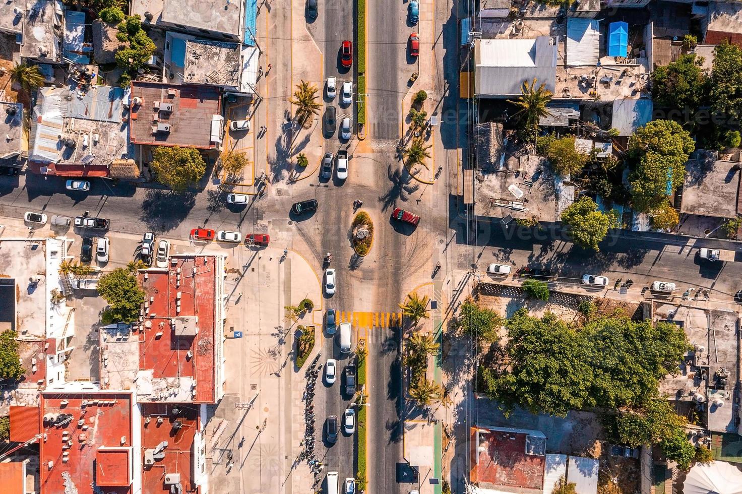 Aerial view of the street intersection with cars driving down the road. photo