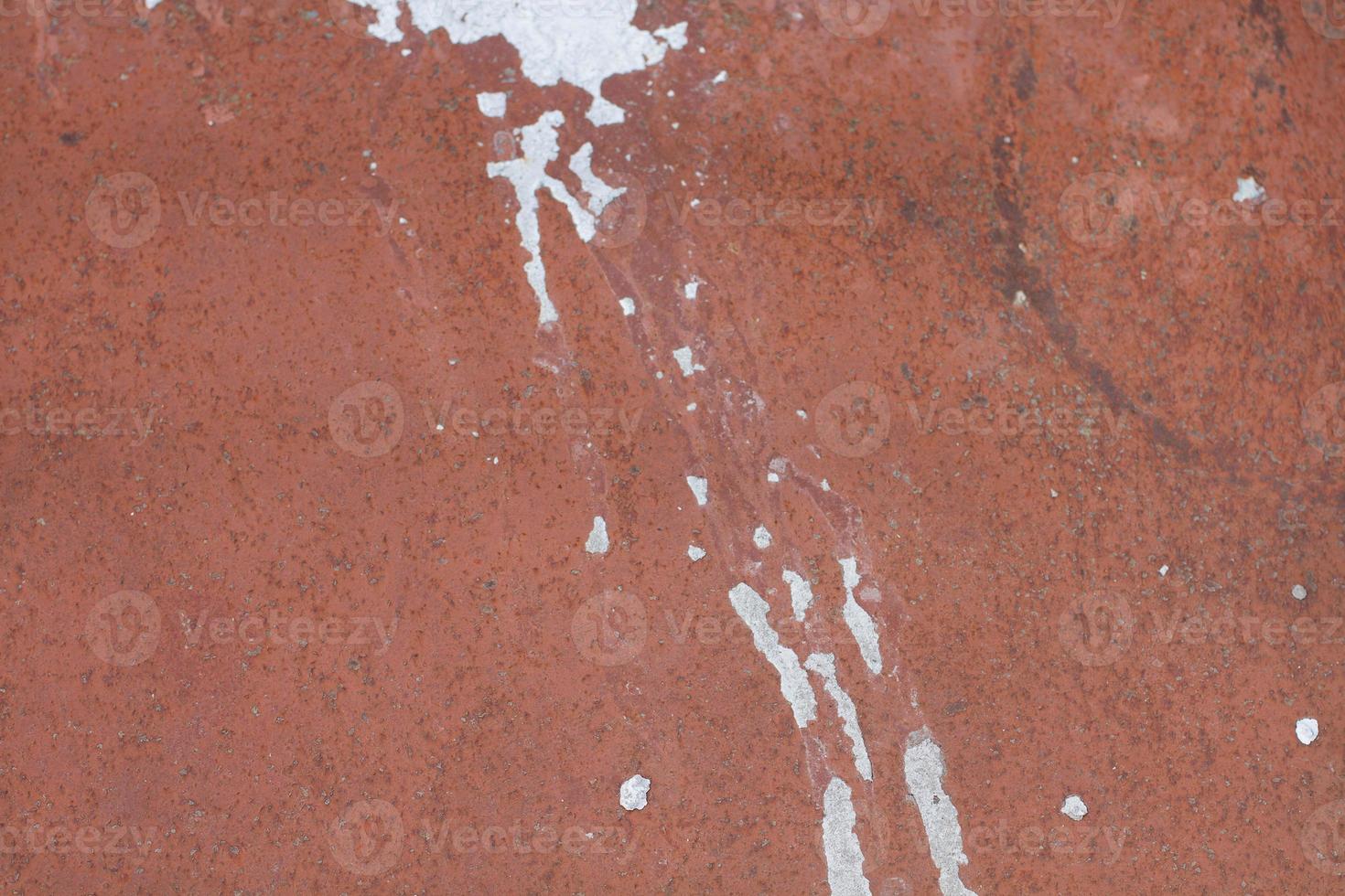 Texture of Wall stains after white rain. Background of wall stains. Stains on red wall. photo