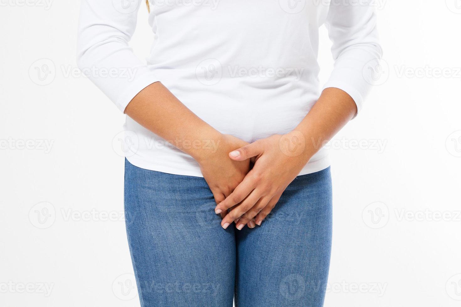 sick woman with hands holding pressing her crotch lower abdomen. Medical or gynecological problems concept,isolated photo