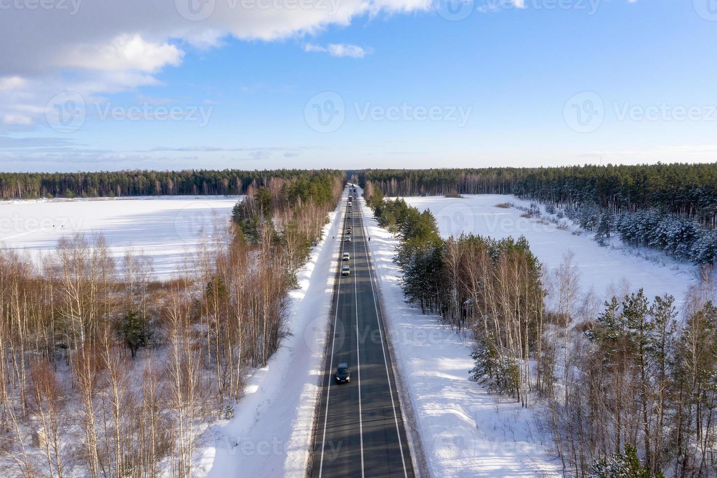 Road in the winter Alps. Winter landscape. Aerial view photo
