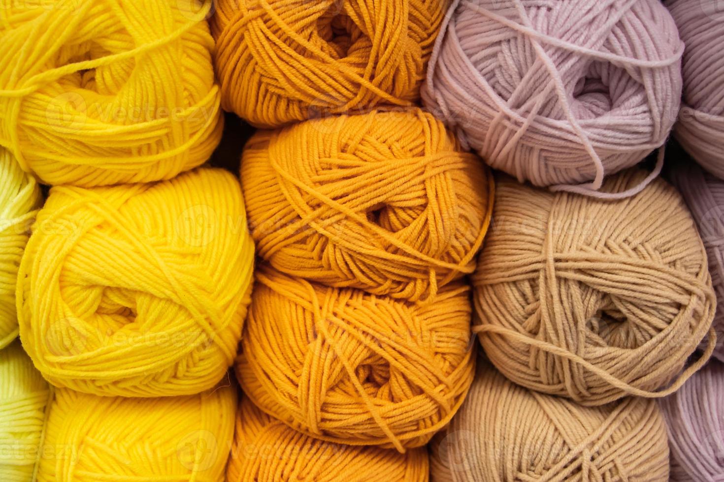 Background from multi-colored fluffy woolen threads for knitting. photo