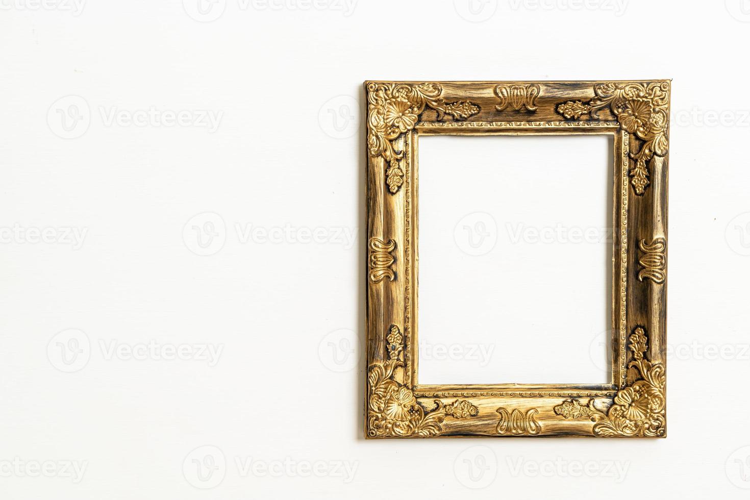 empty picture frame on white wall background photo