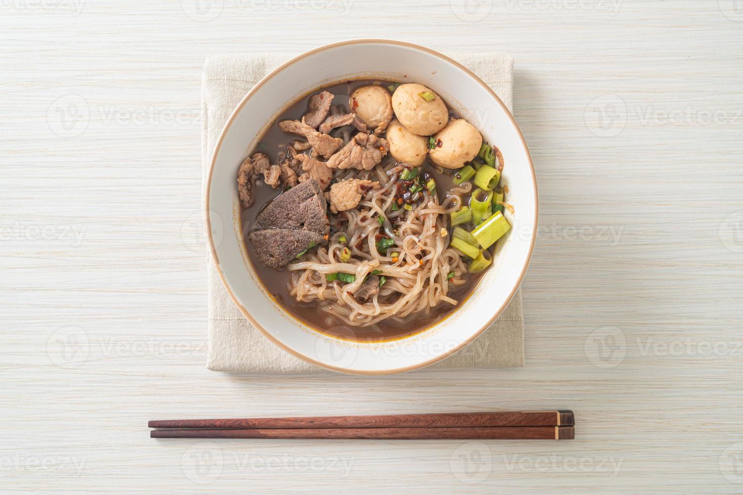 Thai noodle with pork, stewed pork, meatball and pork liver in blood soup photo