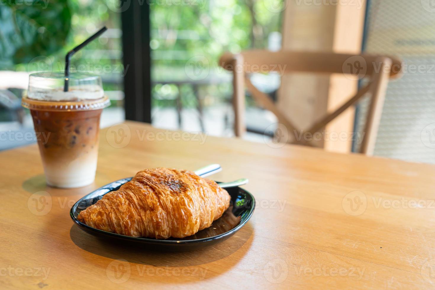 butter croissant on black plate photo