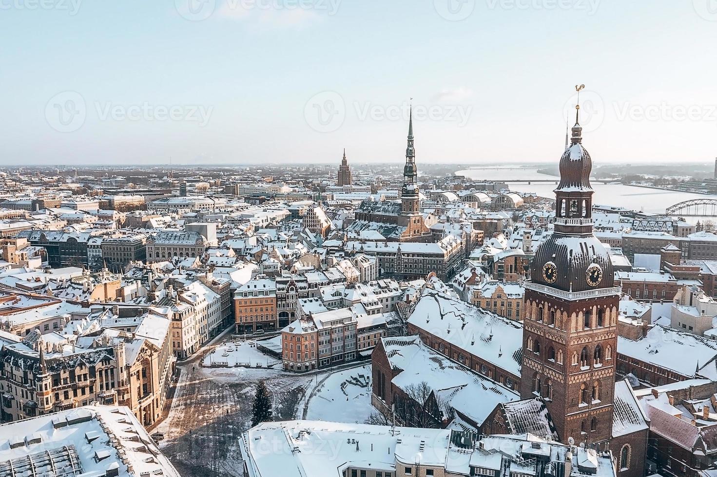 Aerial panorama view of Riga old town during beautiful winter day in Latvia. Freezing temperature in Latvia. White Riga. photo