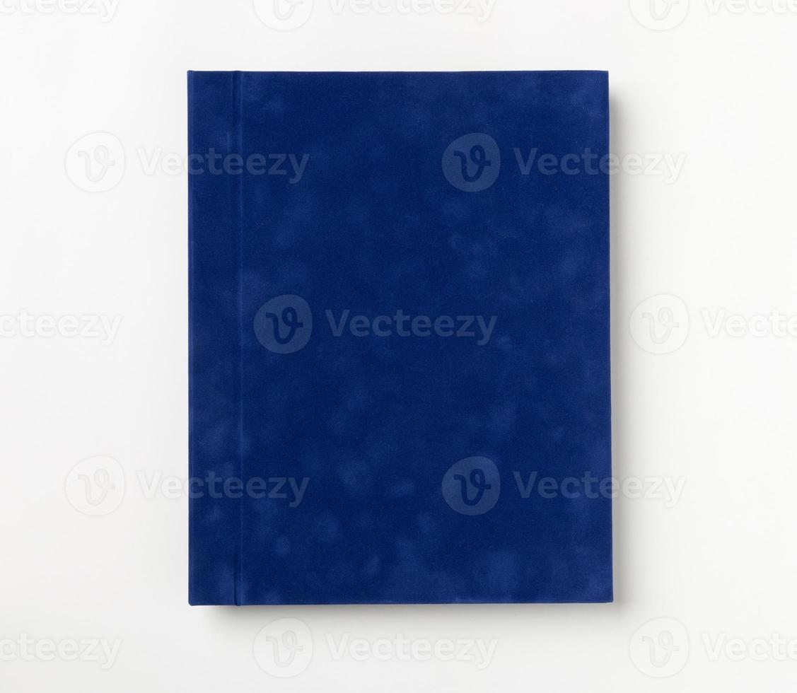 Blue hardcover book, isolated on white background. Top view photo