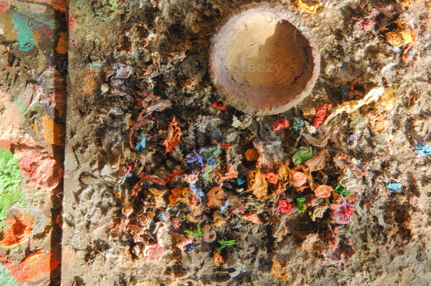 dried paint on a wood surface. top view. concept artistic and creative chaos photo