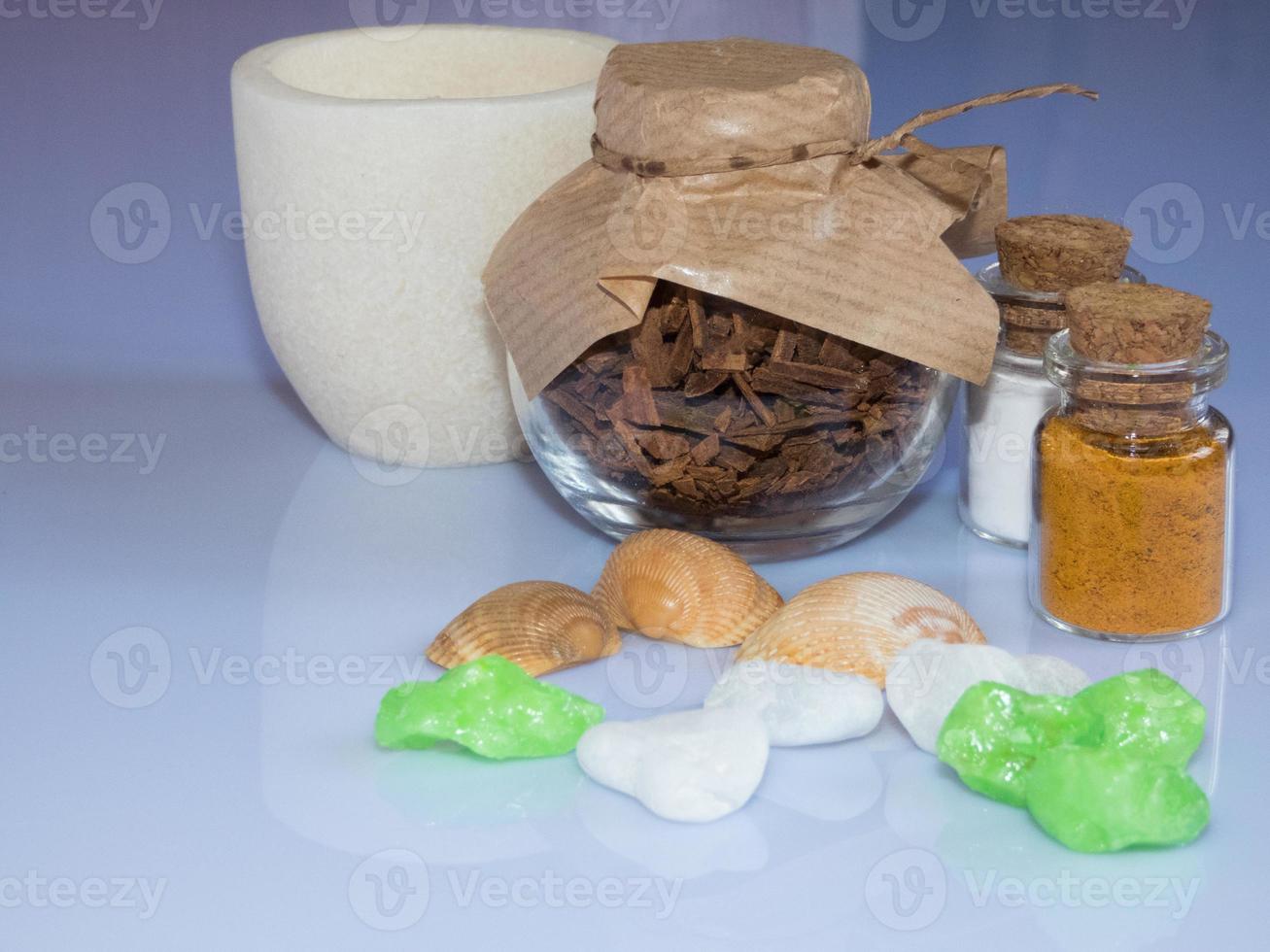 set ingredients and spice for aromatherapy and body care on a white surface with reflection. SPA still life photo