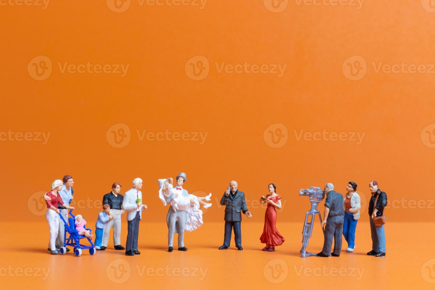 Miniature people Couple live stream marriage ceremony concept photo