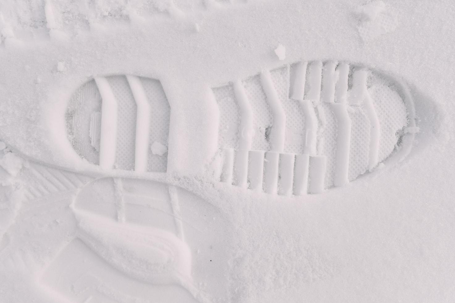 Boot footprint shoe tread texture in snow photo