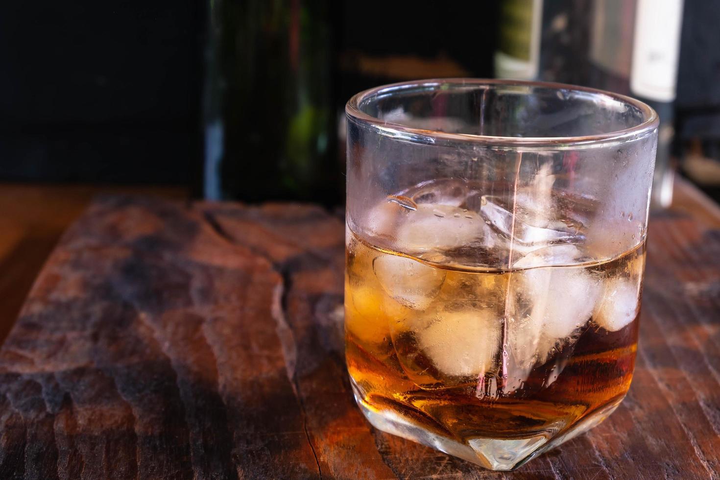 liquor glass on wooden table photo