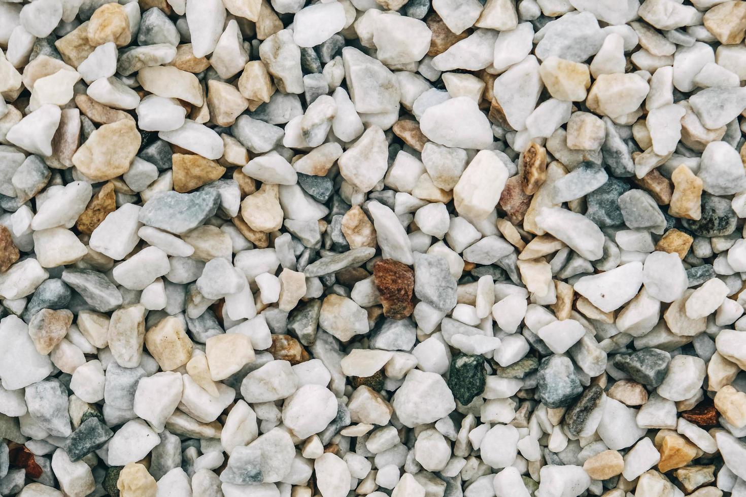 Texture of decorative stones or gravel as a background image. Top view. Copy, empty space for text photo