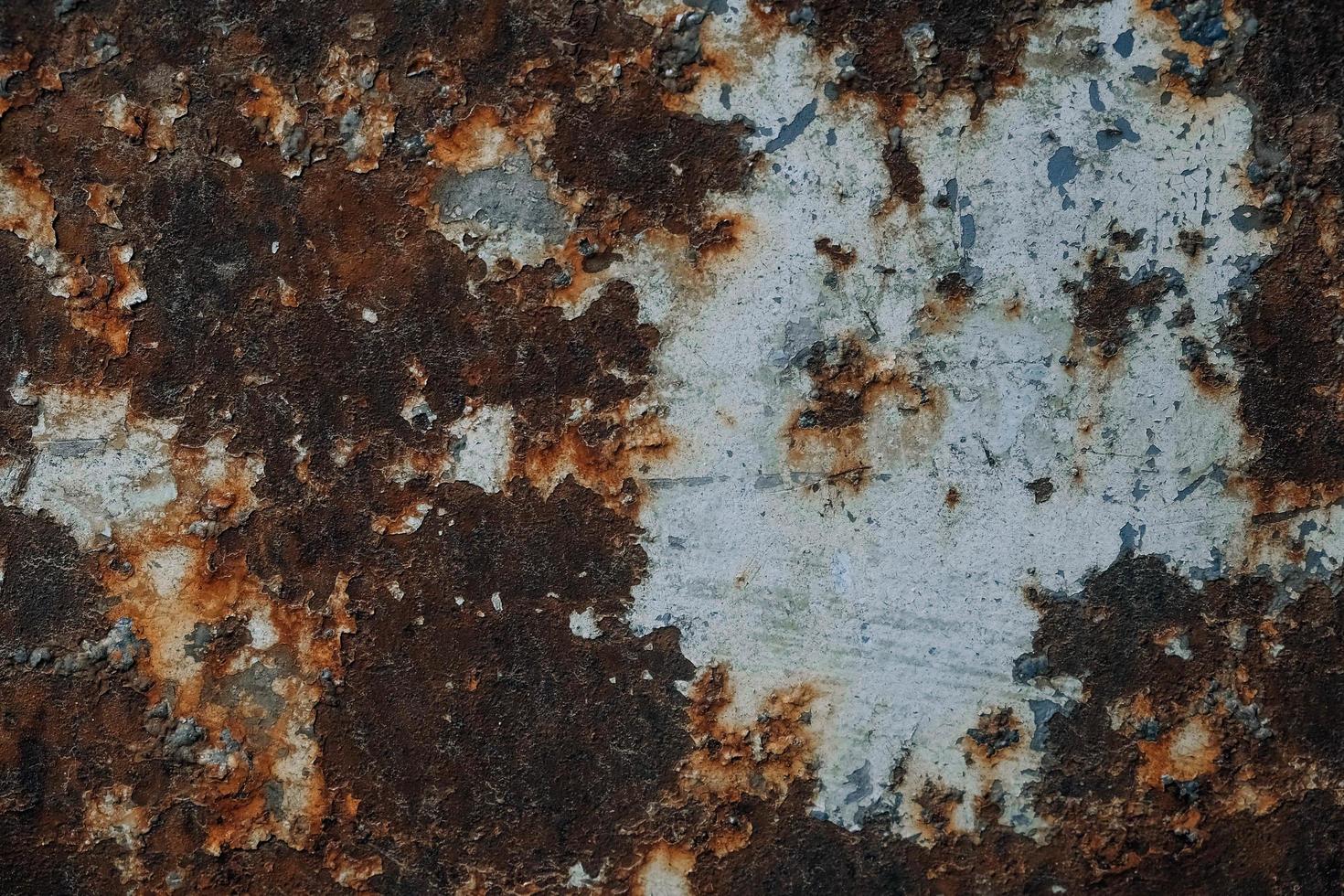 Rusty metal surface with blue paint residue as background image 5121379