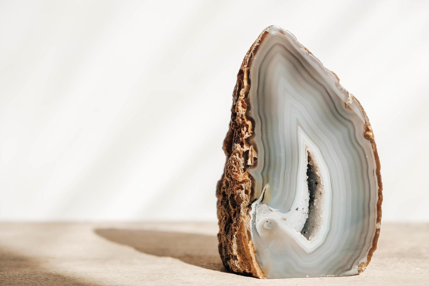 A polished agate mineral on a wooden table photo
