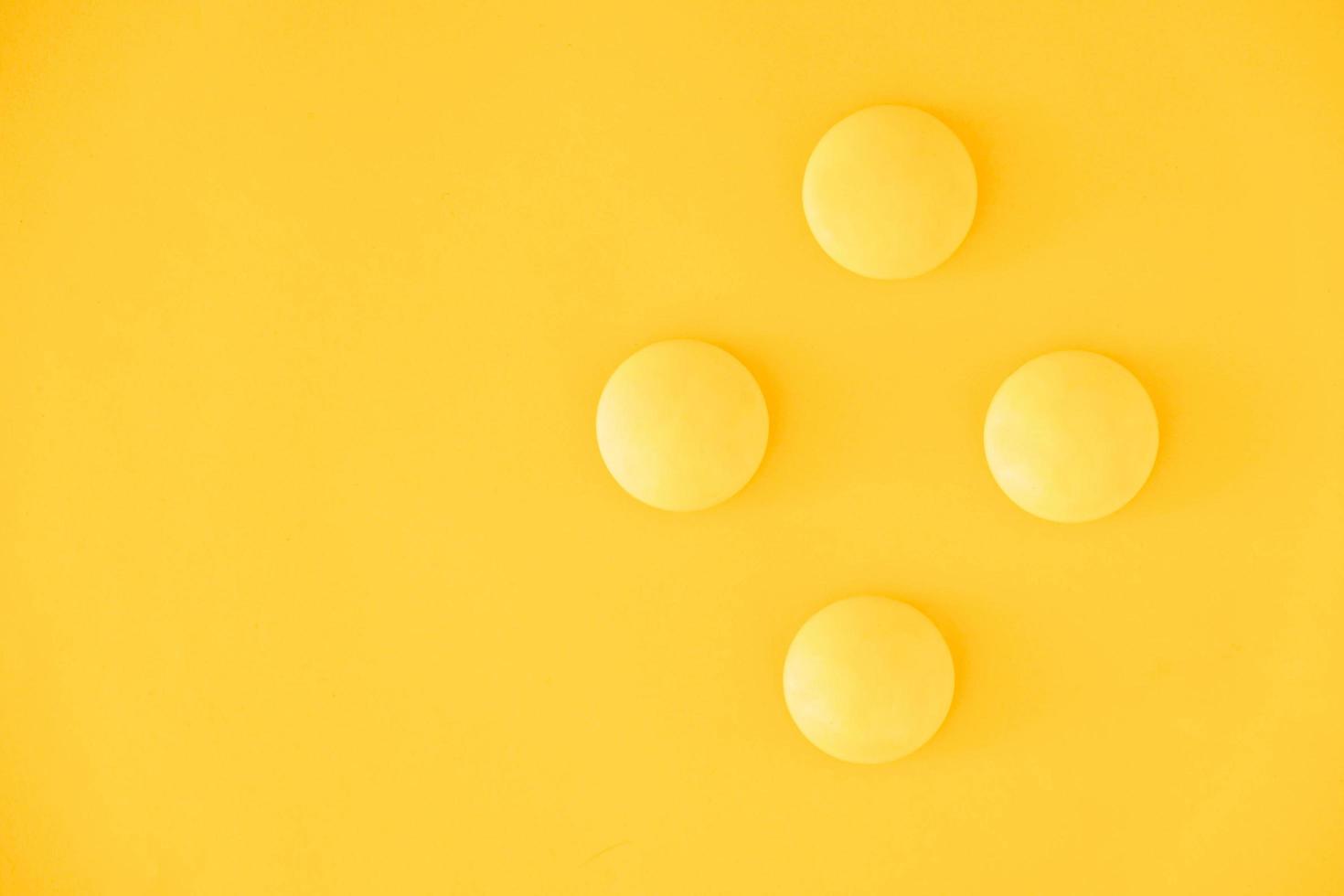 Yellow balls on yellow background. Minimal concept. Top view. Copy, empty space for text photo