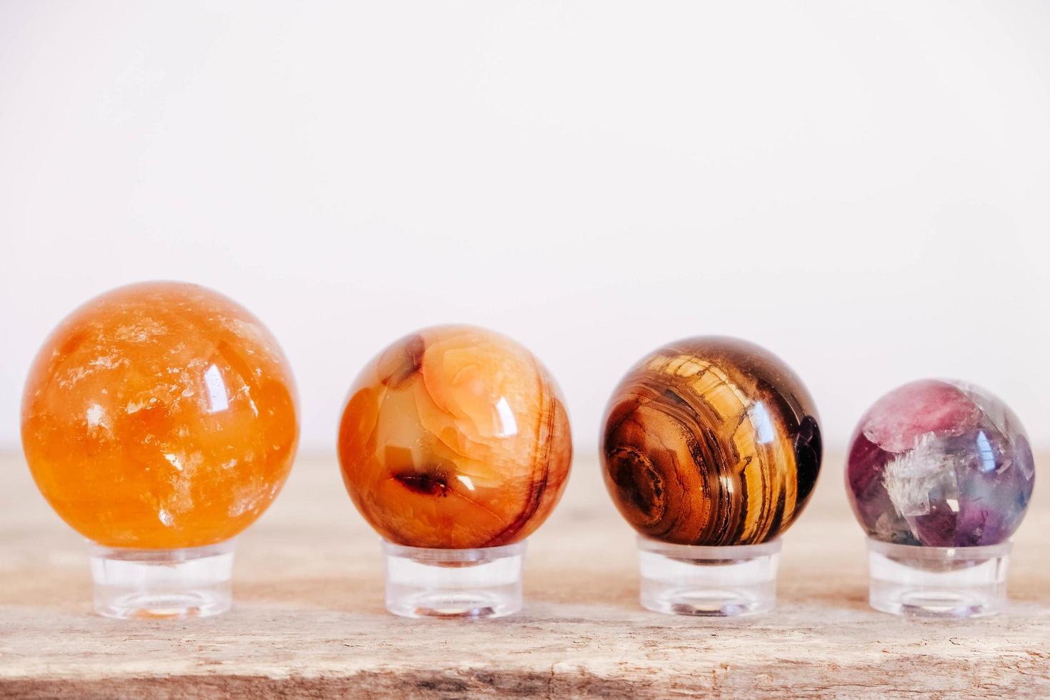 Crystals in the form of balls on a wooden table photo