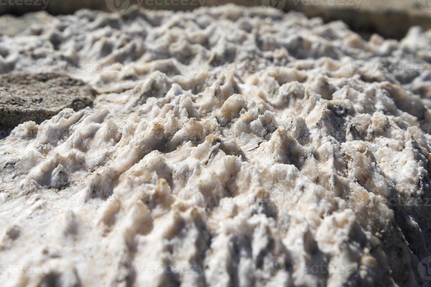 Closeup of white marble stone seamless background pattern or texture. photo