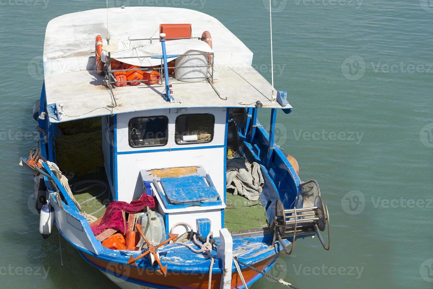 Small fishing boat on the dock. photo