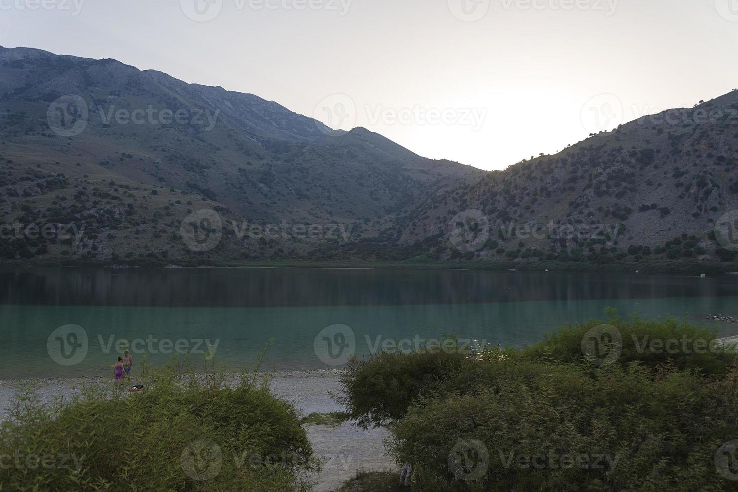 The mountains and the lake with the sunset. photo