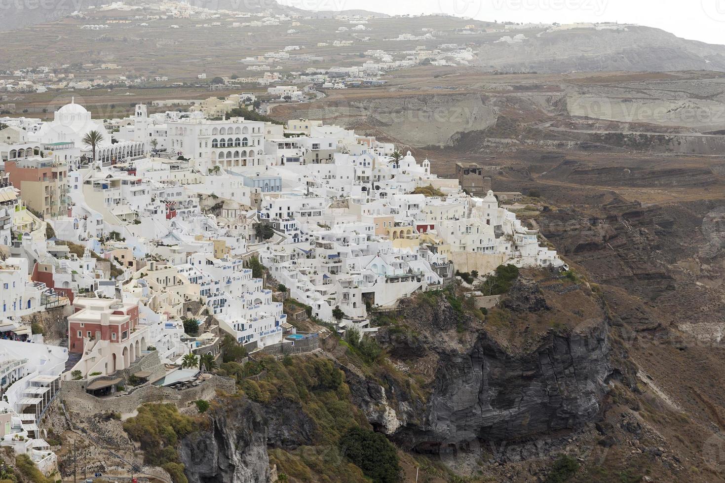 Famous view over the village of Oia at the Island Santorini, Greece photo