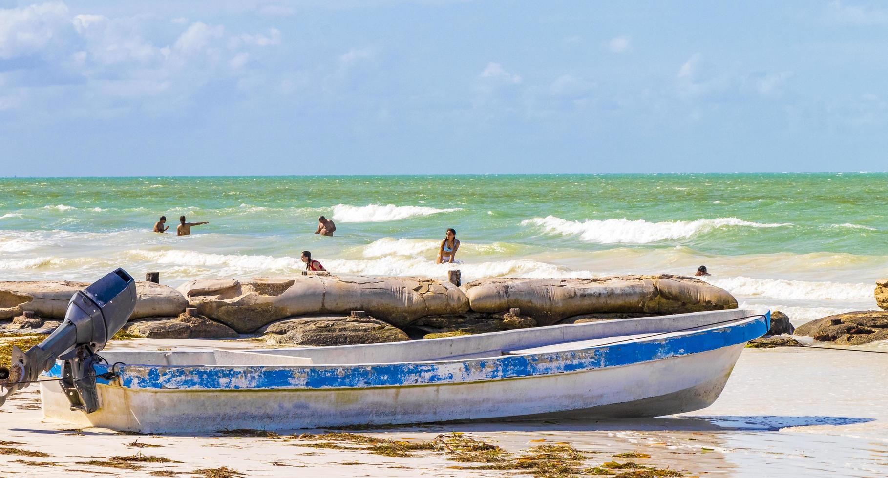 Holbox Mexico 21. December 2021 Beautiful Holbox island beach old blue boat turquoise water Mexico. photo