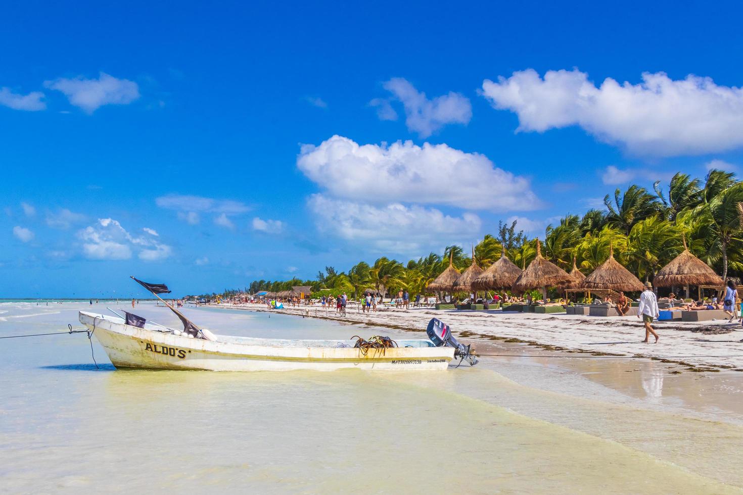 Holbox Mexico 21. December 2021 Beautiful Holbox island beach with boat and turquoise water Mexico. photo