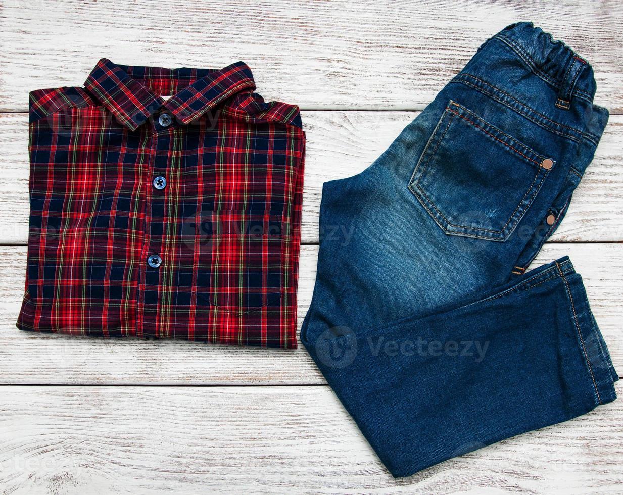 Checkered shirt and jeans photo