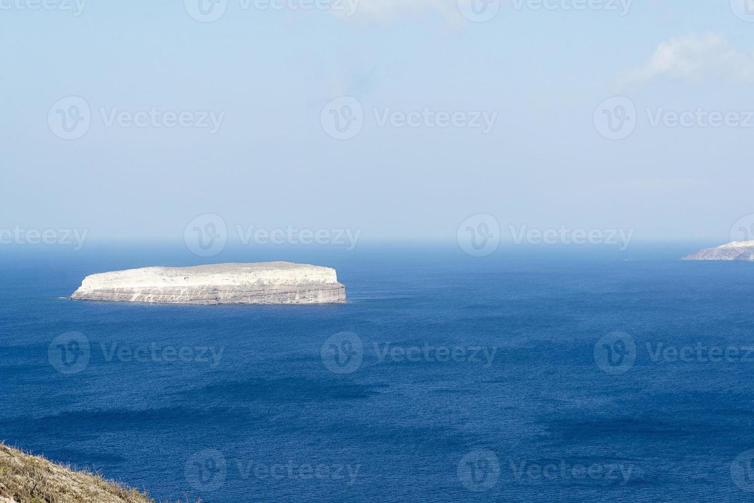 Sweeping landscape overlooking the island of Santorini, Greece photo