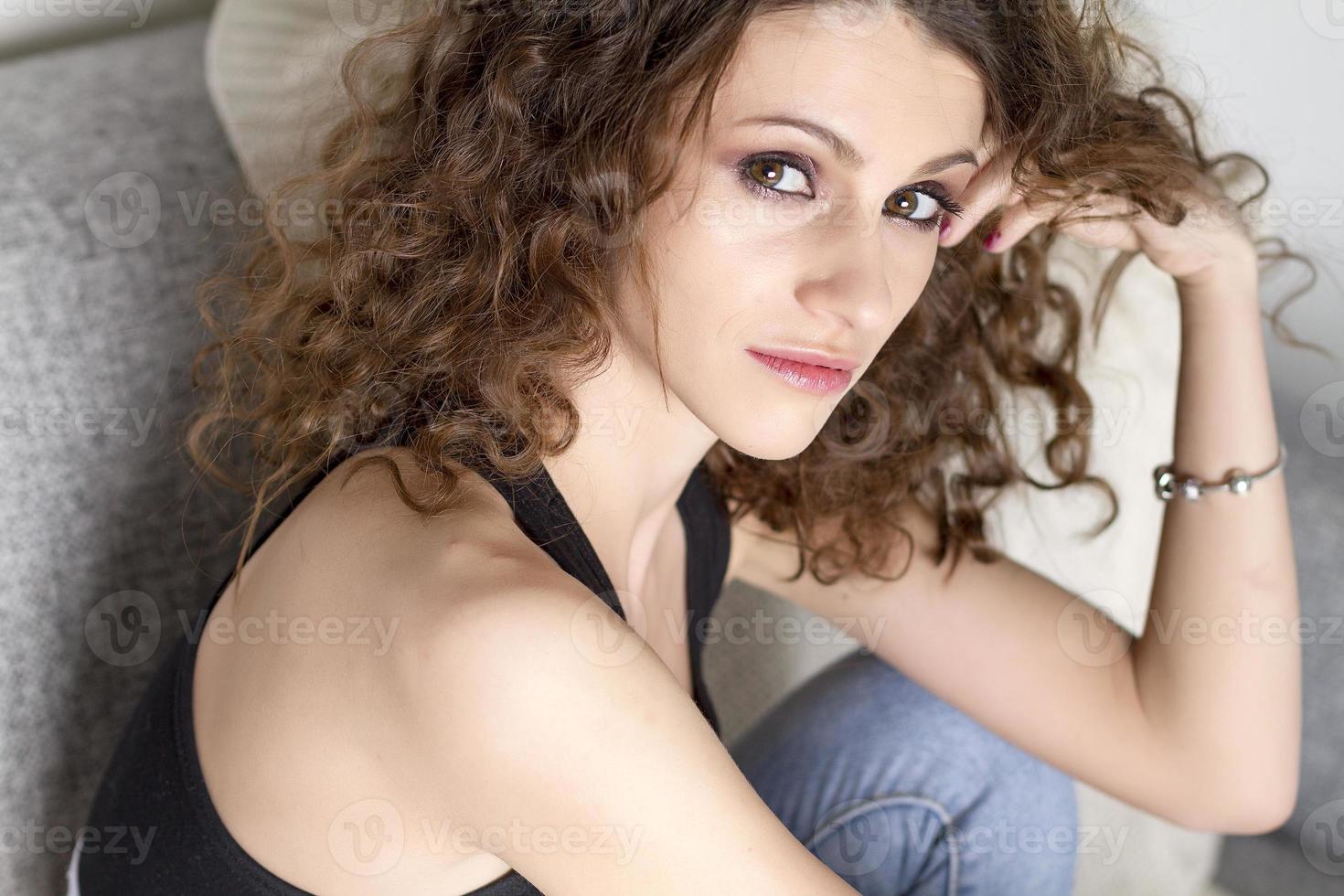 Cute girl with curly hair. photo