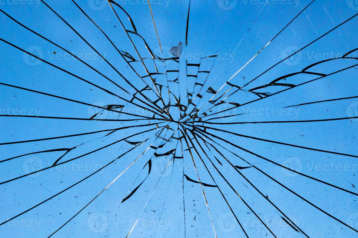 Cracked and abstract glass texture. Transparent material backdrop. Glass effect pattern. Mirror and glass background. photo